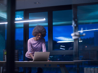 Image showing black businesswoman using a laptop in startup office