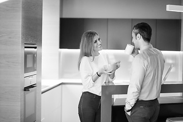 Image showing A young couple is preparing for a job and using a laptop