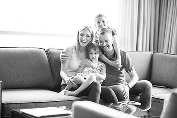 Image showing happy young couple spending time with kids