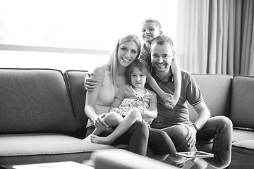 Image showing happy young couple spending time with kids