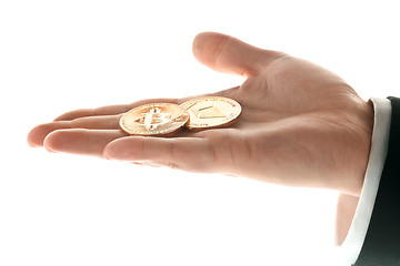 Image showing Male hand with golden bitcoin on white background