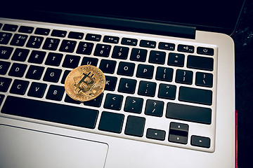 Image showing The golden bitcoin on keyboard