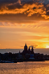 Image showing Amsterdam cityscape skyline with  Church of Saint Nicholas on su