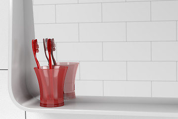 Image showing Two red toothbrushes
