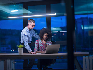 Image showing Multiethnic startup business team in night office