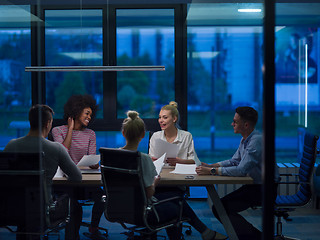 Image showing Multiethnic startup business team in night office