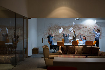 Image showing Group of young business people throwing documents