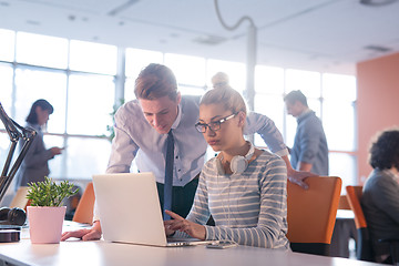 Image showing Two Business People Working With laptop in office