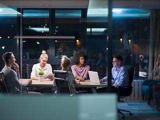 Image showing Multiethnic startup business team in night office