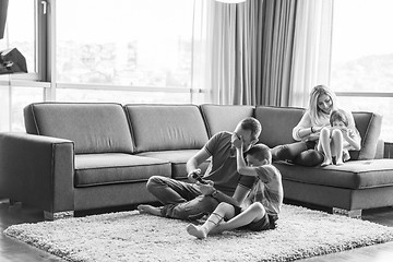 Image showing Happy family playing a video game