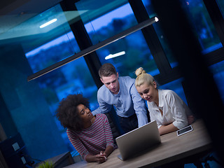 Image showing Multiethnic startup business team in night office