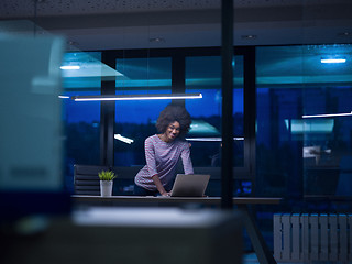 Image showing black businesswoman using a laptop in startup office