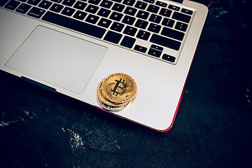 Image showing The golden bitcoin on keyboard