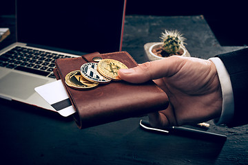 Image showing The golden bitcoin in mail hands