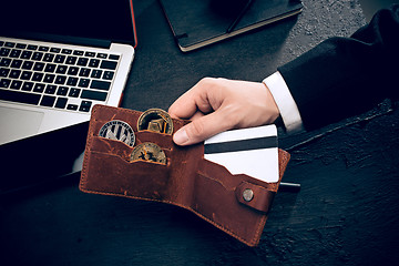 Image showing The golden bitcoin in mail hands