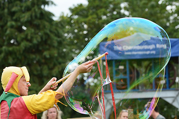 Image showing Bosco the jester produces a large bubble for spectators