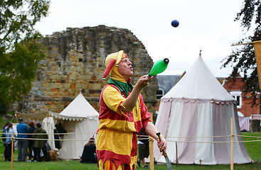 Image showing Bosco the Jester juggles objects at a Medieval Fair