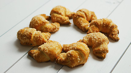 Image showing Fresh croissants laid in circle