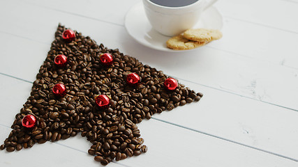 Image showing Coffee beans in shape of conifer and cup