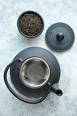 Image showing Black metal oriental teapot isolated