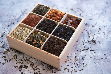Image showing Various kind of dry tea in wooden box