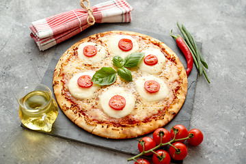 Image showing Homemade pizza with tomatoes, mozzarella