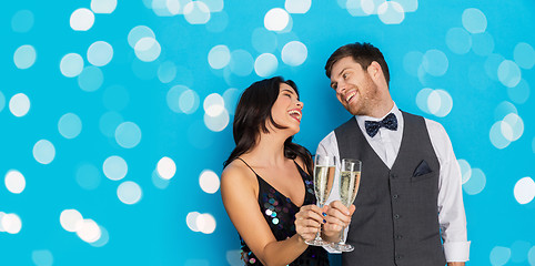 Image showing happy couple with champagne glasses at party