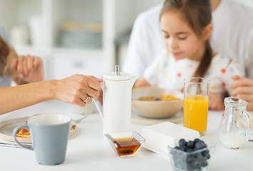 Image showing close up of family having breakfast at home