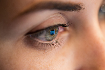 Image showing close up of woman eye looking at computer screen