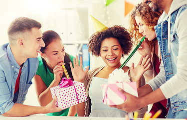 Image showing team greeting colleague at office birthday party