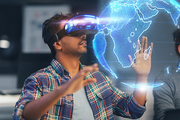 Image showing man in vr headset with earth hologram at office