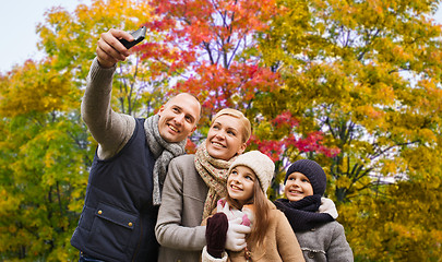 Image showing family taking selfie by smartphone in autumn park