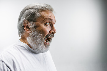 Image showing The senior emotional angry man screaming on white studio background