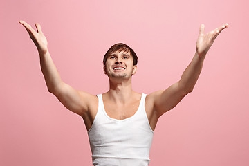 Image showing Winning success man happy ecstatic celebrating being a winner. Dynamic energetic image of male model