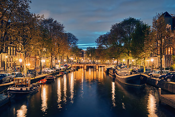 Image showing Amterdam canal, bridge and medieval houses in the evening