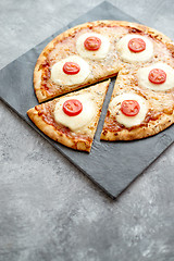 Image showing Homemade pizza with tomatoes, mozzarella