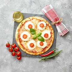 Image showing Homemade pizza with tomatoes, mozzarella