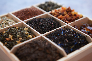 Image showing Various kind of dry tea in wooden box