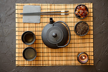 Image showing Asian green tea set on bamboo mat