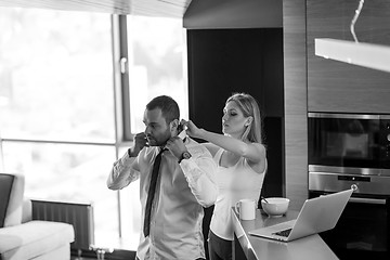 Image showing A young couple is preparing for a job and using a laptop