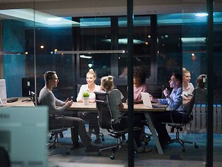 Image showing Multiethnic startup business team in night office