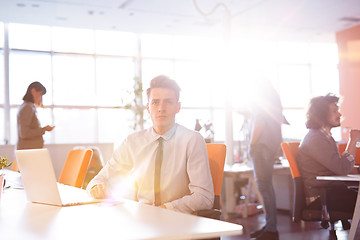 Image showing Young businessman using computer at work