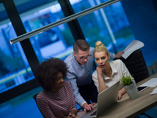 Image showing Multiethnic startup business team in night office