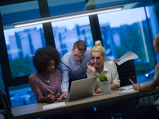 Image showing Multiethnic startup business team in night office