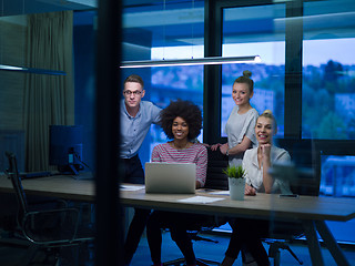 Image showing Multiethnic startup business team in night office