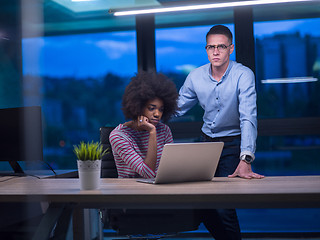 Image showing Multiethnic startup business team in night office