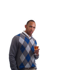 Image showing Young black man in sweater with wine glass