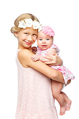 Image showing happy beautiful girl with baby baby sister