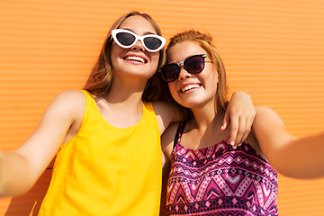 Image showing teenage girls taking selfie outdoors in summer