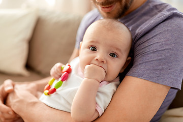 Image showing close up of father with little baby girl at home